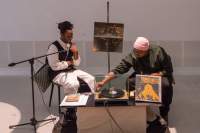 S\*an D. Henry-Smith (left) and Derrais Carter (right). Book launch. *Black Revelry: In Honor of 'The Sugar Shack'*, edited by Carter with contributions from Taylor Renée Aldridge; Samiya Bashir; La Marr Jurelle Bruce; Derrais Carter; DJ Lynnée Denise, William H. Mosley, III, Zoé Samudzi, S\*an D. Henry-Smith, Melanie Stevens and Phillip B. Williams. Design by Karoline Świeżyński. Photo: Konstantin Guz, courtesy of If I Can't Dance, Amsterdam.