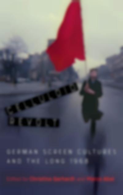 A person runs through an empty street. The trees are bare and the sky is grey. They are holding a large red flag. The title of the book, 