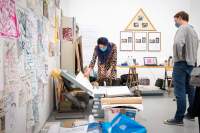 Performance documentation. Sands Murray-Wassink with Megan Hoetger and Radna Rumping, *Backstage with Gift Science Archive*, Rijksakademie Open Studios, Amsterdam, June 2021. Photo: Sander van Wettum, courtesy of the Rijksakademie van beeldende kunsten, Amsterdam.