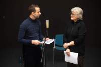 Szymon Adamczak (left) and Sher Doruff (right). Public reading documentation. Grant Watson, *How We Behave / An Archive of Radical Practice*, If I Can't Dance, Amsterdam, December 2023. Photo: Maarten Nauw, courtesy of If I Can't Dance, Amsterdam.