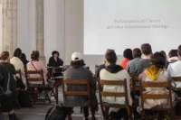 A large white slide with black text that reads 