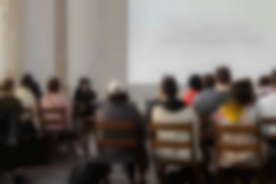 A large white slide with black text that reads 