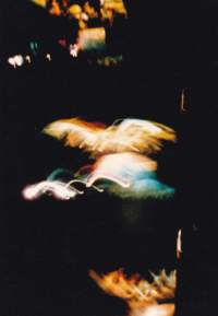 Light streaks on top of black background.