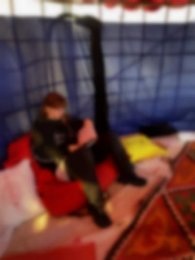 Student sits in an installation in the exhibition *For those who have no time to play* by Gluklya. Framer Framed, Amsterdam, 2022.