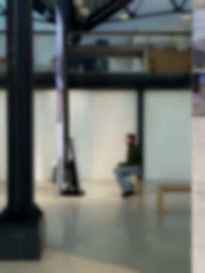 Student sits inside the installation *Performing Colonial Toxicity* by Samia Henni. Framer Framed, Amsterdam, 2023.