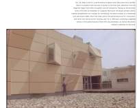 Partial screenshot of a webpage, showing some text and a photograph of a beige building, with someone holding up a mallet in front.