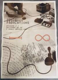 A photo of sound equipment and a microphone set on the floor fill up the whole page. On the top left corner, we can see the bottom half of a person squatting down. Beneath them, black text reads: 