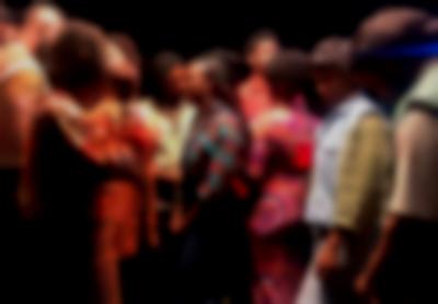 Group of people. Some are talking to each other.